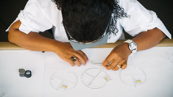 1280-Bird-eye-view-of-Namdeb-employee-sorting-through-rough-diamonds