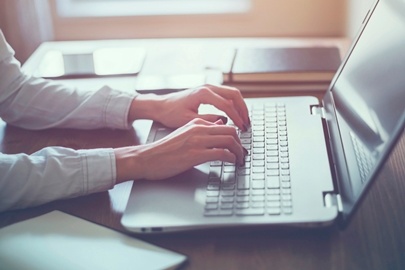 woman typing on a keyboard image